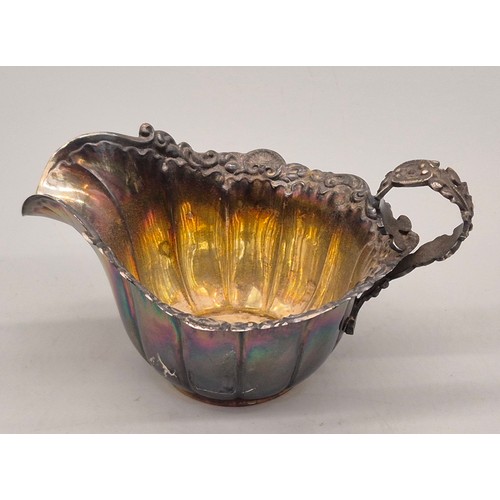 32 - Sheffield silver cream jug. Ornate handle and rim. Produced by Mappin Brothers. 83grams.