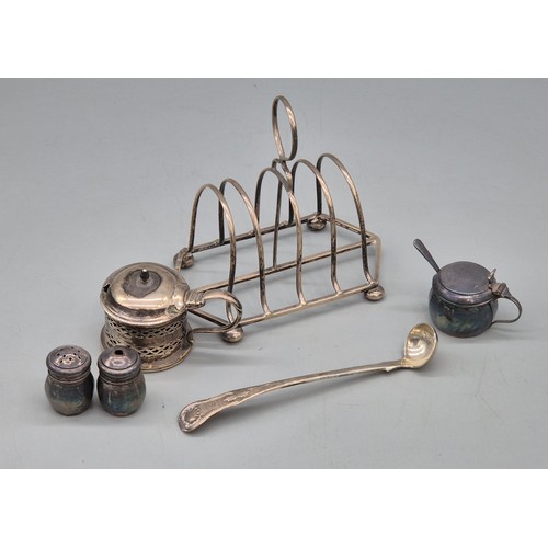 49 - A Selection of silver wares; Chester silver four slice toast rack- produced by Nathan & Hayes. Birmi... 