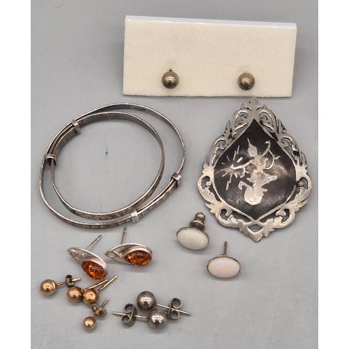 53 - A Collection of silver jewellery and gold stud earrings. Ola M Gorie silver Mackintosh rose brooch, ... 