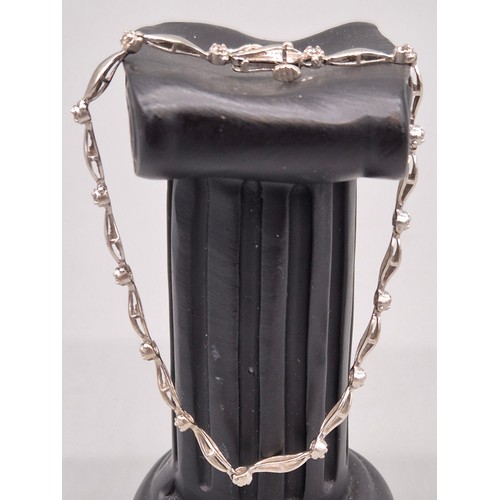 30 - 9ct white gold and diamond ladies bracelet. Round cut diamonds. 4.53grams. 19cm length.