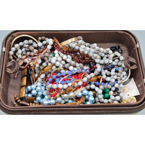 47 - Jewellery box and contents; Two 9ct metal core bangles, various costume necklaces and other items.