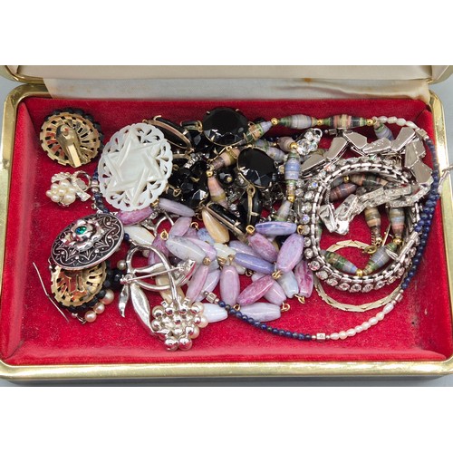 47 - Jewellery box and contents; Two 9ct metal core bangles, various costume necklaces and other items.