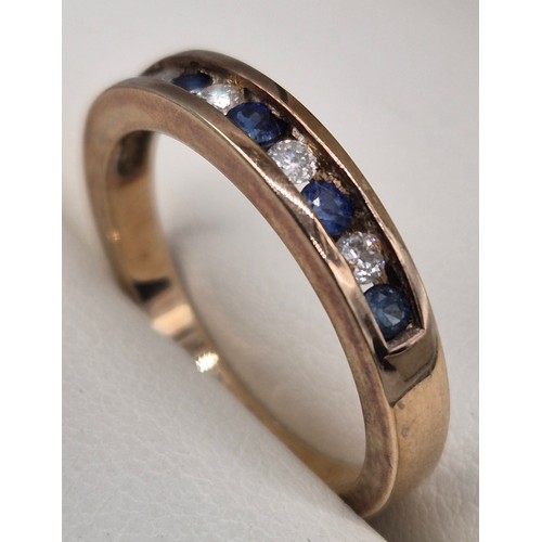 57 - 9ct yellow gold, blue topaz and diamond stone band ring. Round cut blue topaz and diamonds. 0.15cts.... 