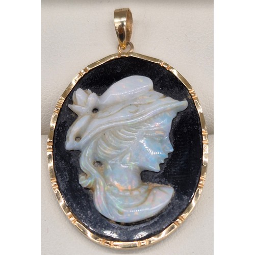 60 - 14ct yellow gold, onyx and Australian opal gem stone cameo carved pendant.