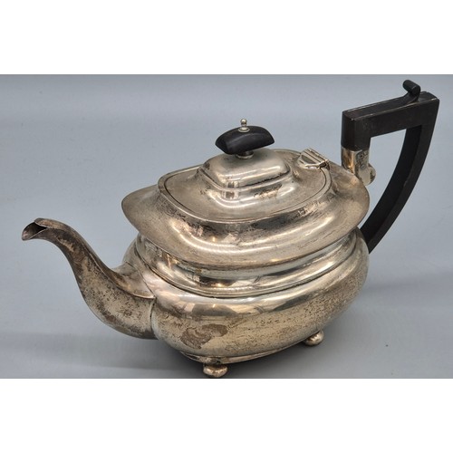 50 - Three piece Birmingham silver tea service. Produced by Hemming & Walton. Tea pot fitted with a woode... 