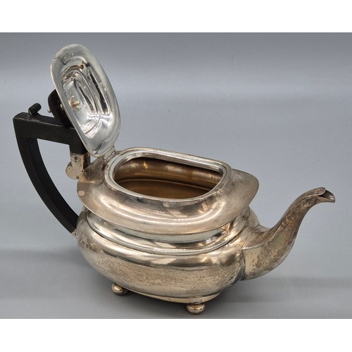 50 - Three piece Birmingham silver tea service. Produced by Hemming & Walton. Tea pot fitted with a woode... 