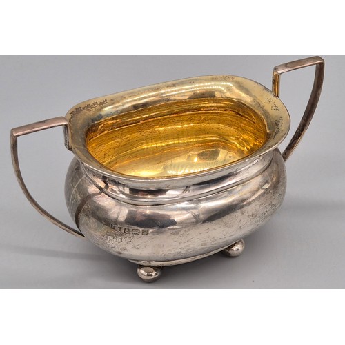 50 - Three piece Birmingham silver tea service. Produced by Hemming & Walton. Tea pot fitted with a woode... 