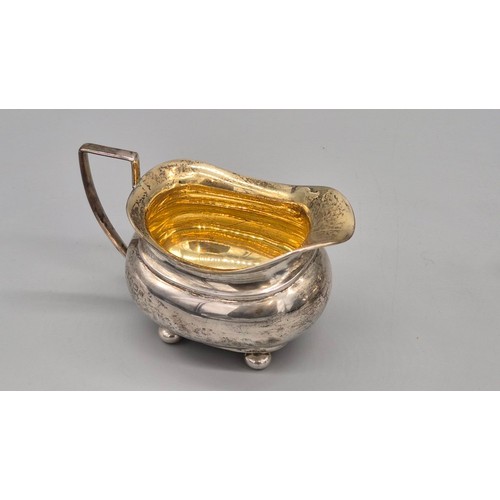 50 - Three piece Birmingham silver tea service. Produced by Hemming & Walton. Tea pot fitted with a woode... 
