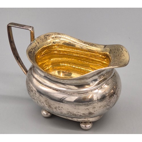 50 - Three piece Birmingham silver tea service. Produced by Hemming & Walton. Tea pot fitted with a woode... 