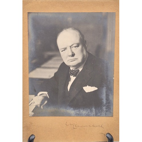 Signed Churchill Photograph.
Silver gelatin print of Winston Churchill seated at the Cabinet table in 10 Downing Street, 13 x 10.7 cm., mounted on board 18 x 13 cm., signed to lower mount, stamped to rear: Photo by Walter Stoneman, F.R.P.S. of J. Russell & Sons, 63 Baker Street, London W.1. 
with
Typed letter on  Woodford Conservative Association headed paper signed by Frederick J. Mummery, Hon. Secretary & Agent, addressed to J. Stanners, advising him that "Mr. Churchill's Private Secretary has sent the enclosed signed photograph to me stating that Mr. Churchill was most anxious that it should be given to the Motor Cyclist Escort who guided his car from the Blackwall Tunnel to Woodford and back on 10 July last..."
and
Typed copy of the recipient's response to Churchill thanking him for the photograph and stating "your personal acknowledgement of such a small service is in keeping with the great services that you have rendered  to the nation during your long and distinguished career".
As Leader of the Opposition, Churchill had delivered a blistering speech to his Woodford Constituency on the day referenced attacking the Labour Party and, in particular, Aneurin Bevan who, speaking in Manchester a few days prior, had labelled the Conservatives "lower than vermin".
and
Queen Elizabeth II Police Exemplary Medal with ribbon awarded to Archibald Stanners, along with 2 Churchill-related magazines and a folder of hand-written Churchillian quotations.