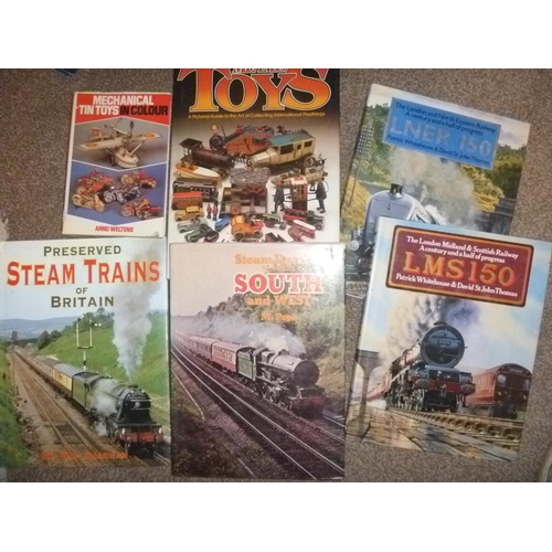 212 - selection of toys and train reference books