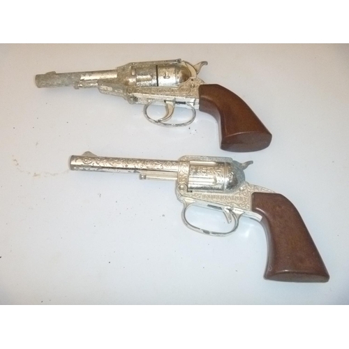 58 - crescent colorado and pecos kid cap guns cowboy style, unchecked, with playwear and faults