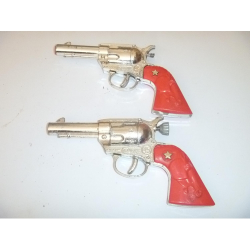 59 - 2 lone star guns cork style, unchecked, with playwear and faults