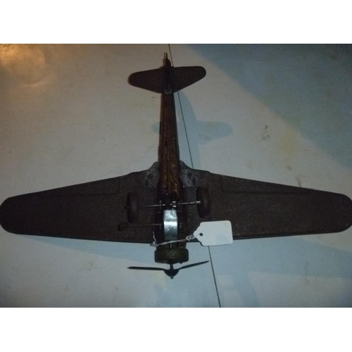 107 - early large Mettoy tinplate folded wing aircraft, body tarnished and rusty but model is solid and re... 