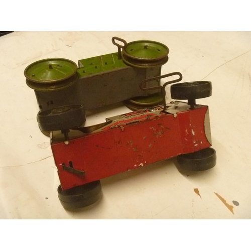 163 - 2 TINPLATE CLOCKWORK TRACTORS BY MARX, MOTORS RUN BUT WHEELS DO NOT ENGAGE PROPERLY AND SLIP