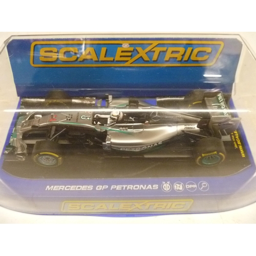 SCALEXTRIC SLOT CAR - MERCEDES GP PETRONAS (SLOT CARS HAVE BEEN REMOVED FROM THEIR BOXES AT SOME POINT BUT MOSTLY APPEAR TO ONLY HAVE HAD LIGHT, CAREFUL USE. A FEW HAVE HAD RACING ROUNDELS APPLIED. MOST BOXES ARE LACKING SOME PACKAGING COMPONENTS TO INCLUDE, BUT NOT LIMITED TO, THE FIXING THAT SECURES THE MODEL TO THE BOX BASE, A VERY FEW BOXES MAY BE INCORRECT FOR THE MODEL)