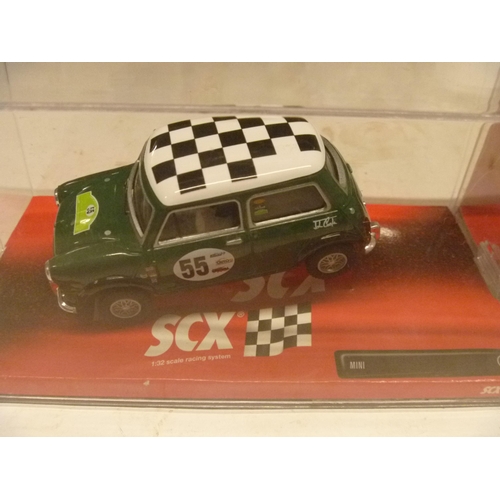 266 - SCX / SCALEXTRIC SLOT CAR - ASTON MARTIN DBR9 AND MINI COOPER (SLOT CARS HAVE BEEN REMOVED FROM THEI... 