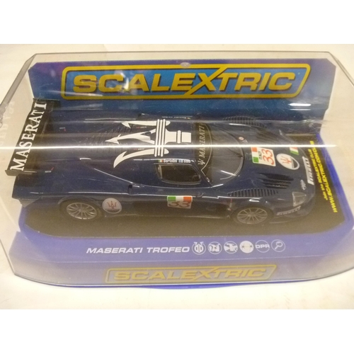 SCALEXTRIC SLOT CAR - MASERATI TROFEO (SLOT CARS HAVE BEEN REMOVED FROM THEIR BOXES AT SOME POINT BUT MOSTLY APPEAR TO ONLY HAVE HAD LIGHT, CAREFUL USE. A FEW HAVE HAD RACING ROUNDELS APPLIED. MOST BOXES ARE LACKING SOME PACKAGING COMPONENTS TO INCLUDE, BUT NOT LIMITED TO, THE FIXING THAT SECURES THE MODEL TO THE BOX BASE, A VERY FEW BOXES MAY BE INCORRECT FOR THE MODEL)