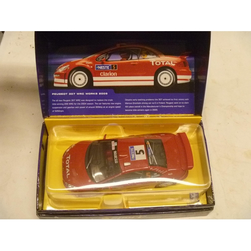 SCALEXTRIC SLOT CAR - PEUGEOT 307 WRC WORKS (SLOT CARS HAVE BEEN REMOVED FROM THEIR BOXES AT SOME POINT BUT MOSTLY APPEAR TO ONLY HAVE HAD LIGHT, CAREFUL USE. A FEW HAVE HAD RACING ROUNDELS APPLIED. MOST BOXES ARE LACKING SOME PACKAGING COMPONENTS TO INCLUDE, BUT NOT LIMITED TO, THE FIXING THAT SECURES THE MODEL TO THE BOX BASE, A VERY FEW BOXES MAY BE INCORRECT FOR THE MODEL)