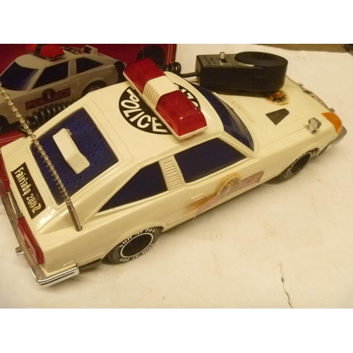 95 - ELECTRONIC DATSUN 240Z 260 Z POLICE SON AI TOYS 1/12 SCALE LIGHTS AND SOUNDS WORK, MOTOR SLIPS