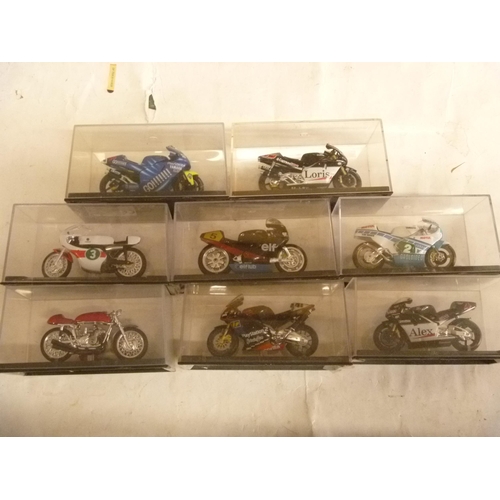 153 - 8 MOTORCYCLES CONTAINED WITHIN RIGID PERSPEX CASES (1 COWLING DETACHED)