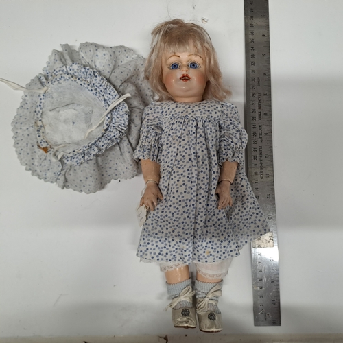 BELIEVED BY STEPHEN SCHILLING OF GERMANY CIRCA 1920's, APPROX 14 INCH HEIGHT COMPOSITION DOLL (PAPIER MACHE) HEAD + BODY, JOINTED HEAD, ARMS, WRISTS + LIPS. COBALT BLUE GLASS FIXED EYES WITH PAINTED EYE LASHES.