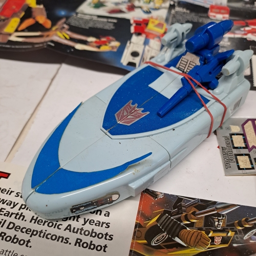 45 - 1986 Hasbro / Takara Transformers Decepticon G1 Scourge�action figure with some associated paperwork