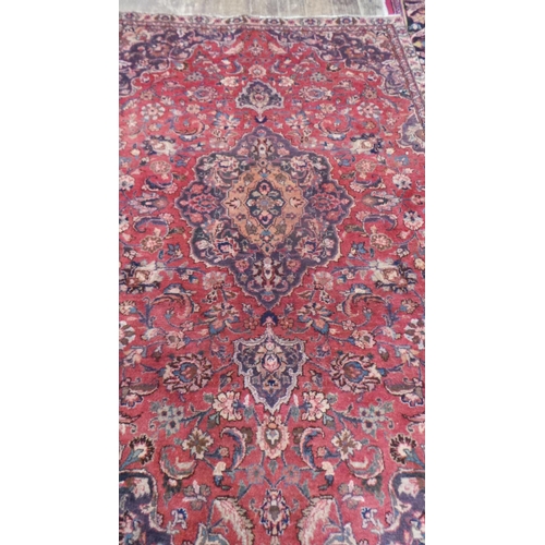 437 - Washed Red Ground Persian Mashad Rug with Traditional Medallion Design, 225cm x 140cm