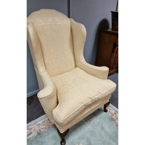 35 - Upholstered Wing Back Armchair on cabriole legs