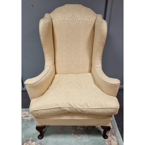 35 - Upholstered Wing Back Armchair on cabriole legs