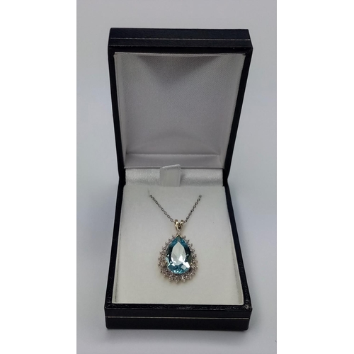 202 - Gold, Blue Topaz, Diamond Pendant, on 16