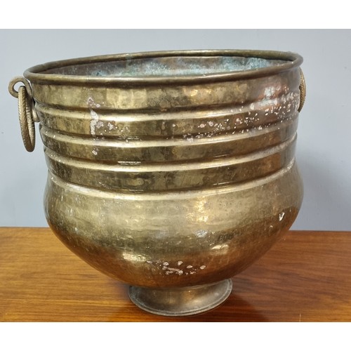 294 - Brass Jardinere

Height 31cm
Diameter 36cm inc.handles Opening 31cm