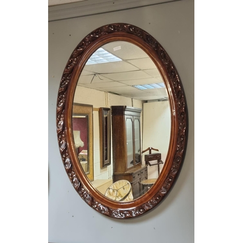 295 - Carved Mahogany Framed Wall Mirror

Height 89cm   Width 63.5cm