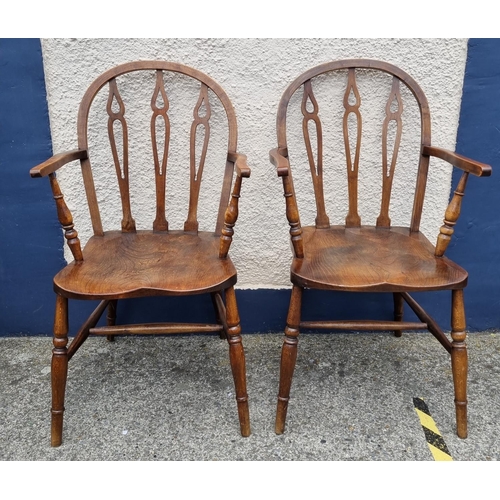 732 - Pair of Elm and Beech low back Windsor style armchairs on turned supports and stretchers.