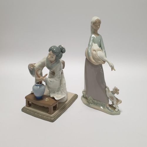 36 - Two Lladro figures: Girl with Goose and Dog (H: 18cm) & Geisha with Flowers