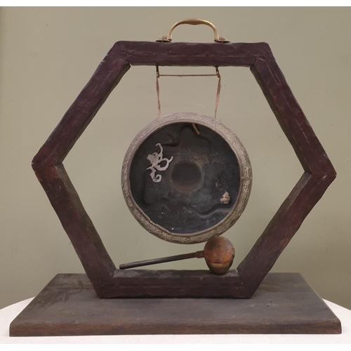 109 - Oriental Dinner Gong on Stand complete with striker, H:45 x W:55cm approx.