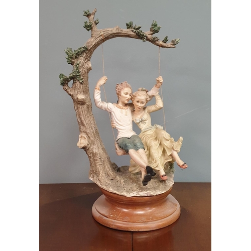 120 - Capidomonte Ornament - Couple on Swing. Height: 44cm