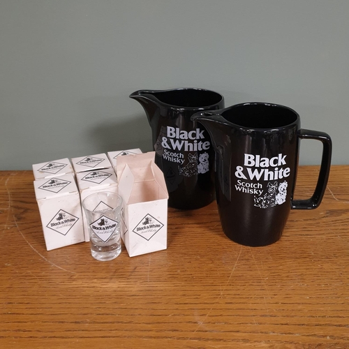 136 - Two Black & White Scotch Whiskey Pub Jugs and Seven Shot Glasses