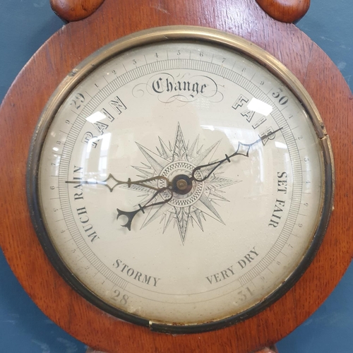 148 - Early 20th century carved oak wall hanging
barometer. H:92 x W:28cm