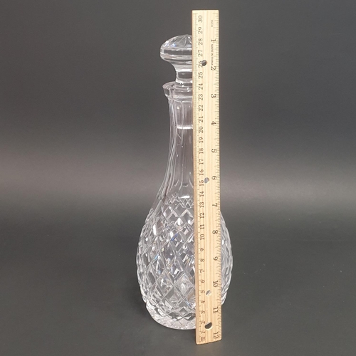 198 - A Waterford Crystal Decanter (H:28cm) and Four Sherry Glasses (H:10.5cm)