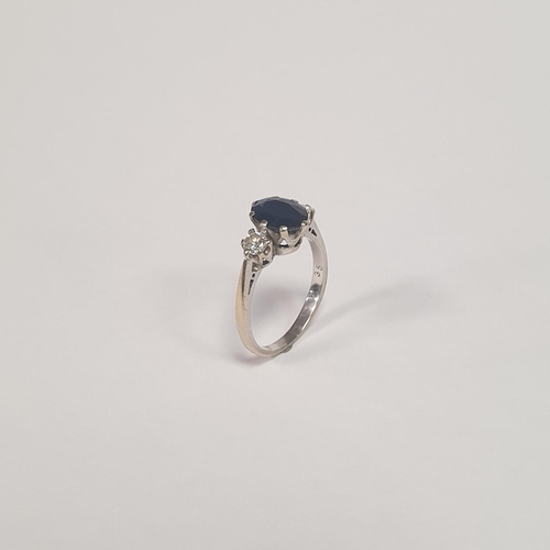 312 - An 18ct White Gold Two Stone Diamond and Oval Sapphire Dress Ring. Diamond approx 28pts, Sapphire ap... 