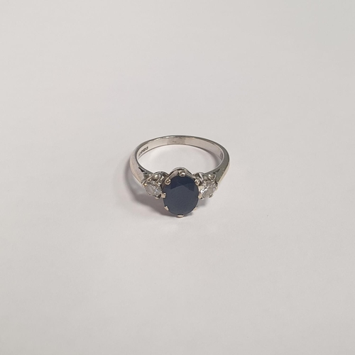 312 - An 18ct White Gold Two Stone Diamond and Oval Sapphire Dress Ring. Diamond approx 28pts, Sapphire ap... 