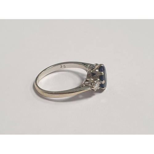 312 - An 18ct White Gold Two Stone Diamond and Oval Sapphire Dress Ring. Diamond approx 28pts, Sapphire ap... 