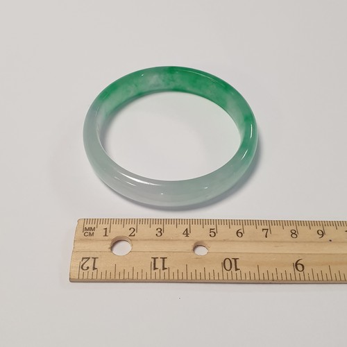 496 - Jade Bracelet. Opening measures 6cm in Diameter