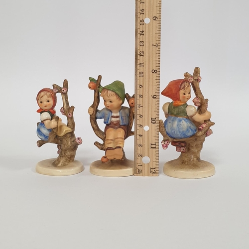 581 - Three Hummel Figures  - Apple Tree Boy and Apple Tree Girl. Tallest 11cm approx.