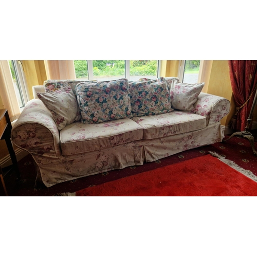 22 - Floral Upholstered Three Seater Sofa - Loose Covered. H: 77cm x W: 227cm x D: 95cm