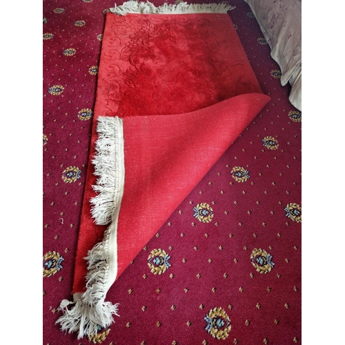 23 - Red Wool Embossed Floor Rug, overall 177cm long x 78cm wide (pile depth 10mm)