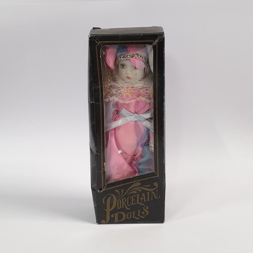 519 - Porcelain Doll in box, Height approx. 22cm