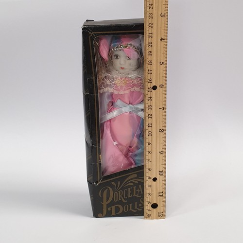 519 - Porcelain Doll in box, Height approx. 22cm