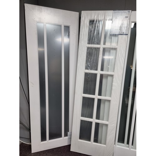 809 - Lot of 2x White Internal Doors 
8 Window Panel - h: 188cm x w: 61cm x d: 3.5cm 
3 Long Panel - h: 18... 